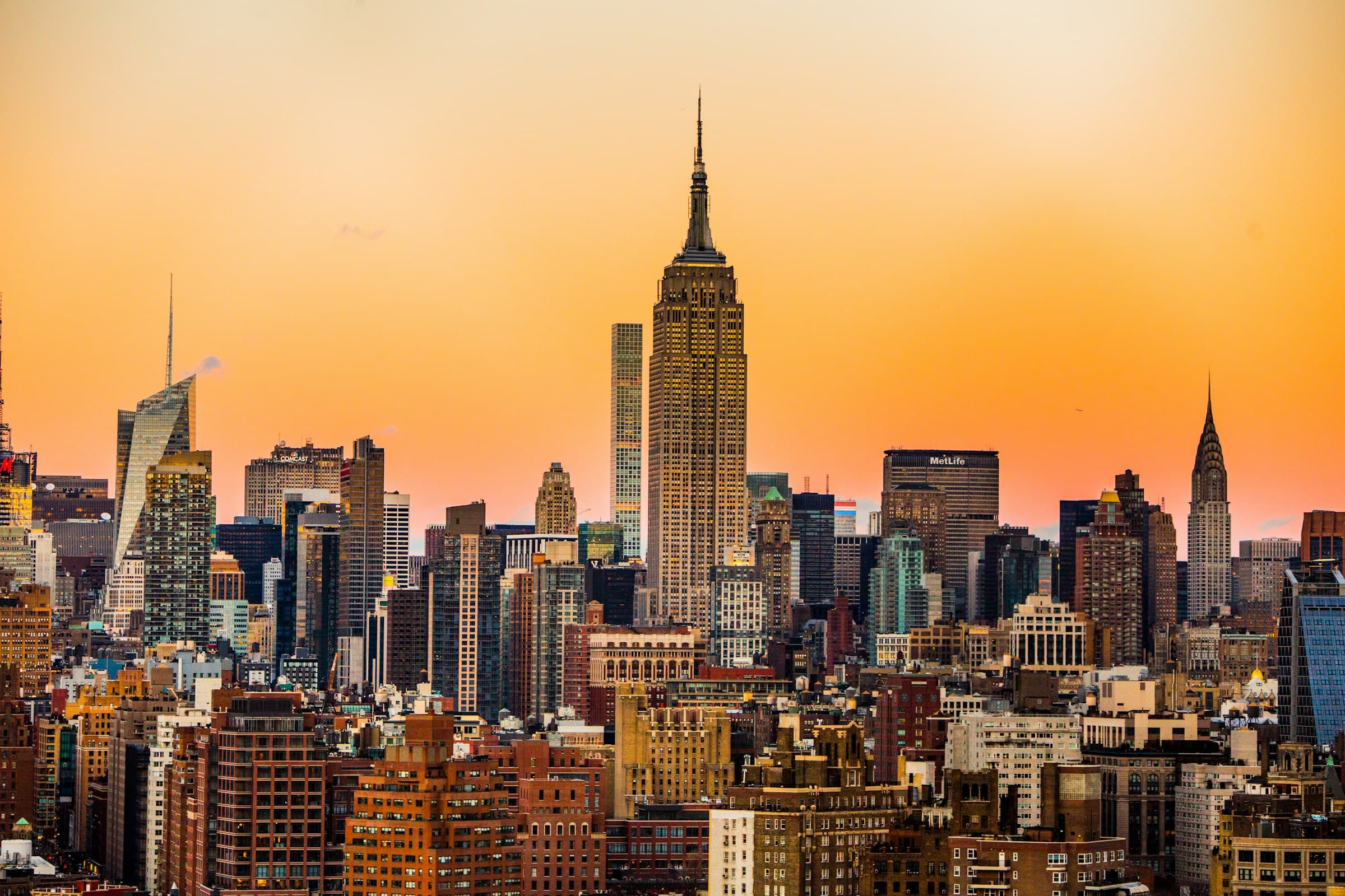 Midtown Manhattan skyline with the Empire State Building under a golden sunset