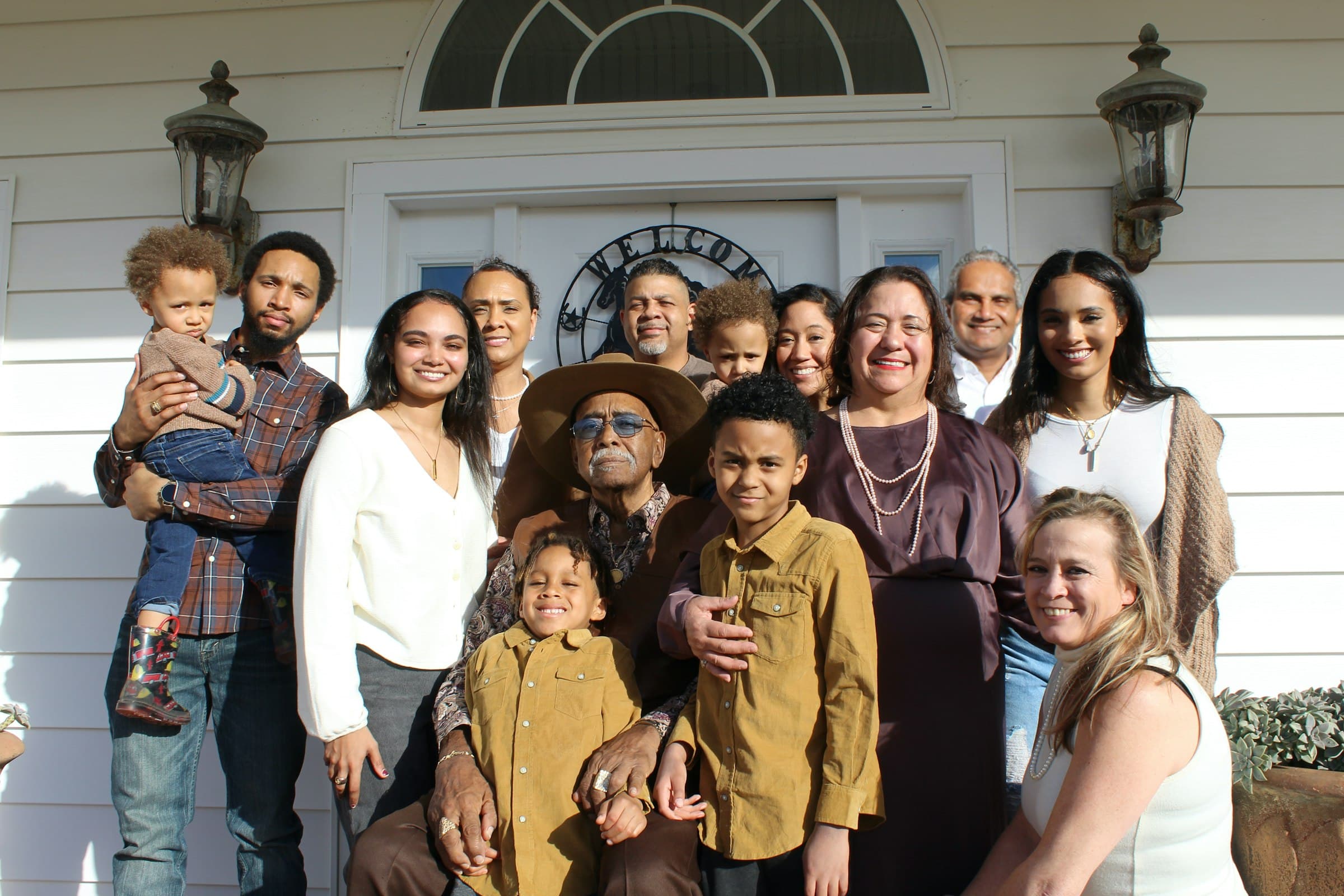 Multigenerational family posing together at home