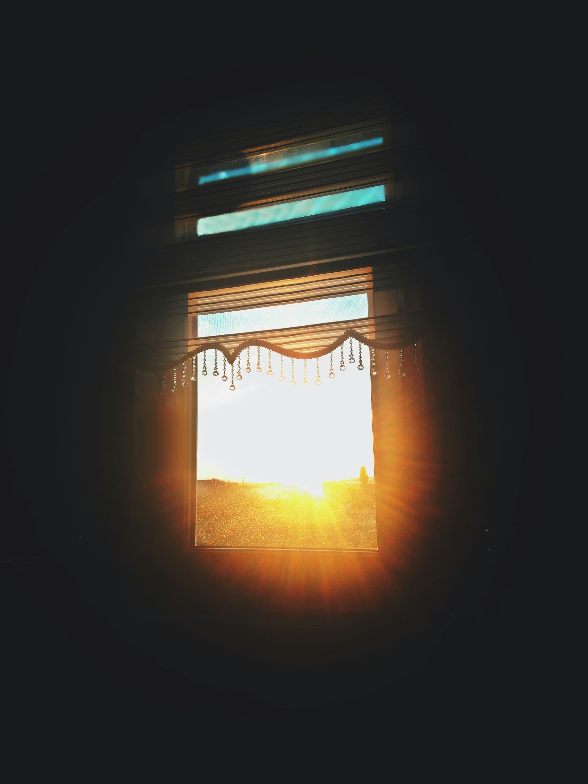 Sunrise filling a dark room with golden, hopeful light